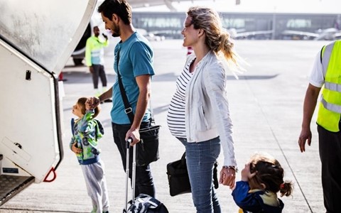 A family getting onto a plane