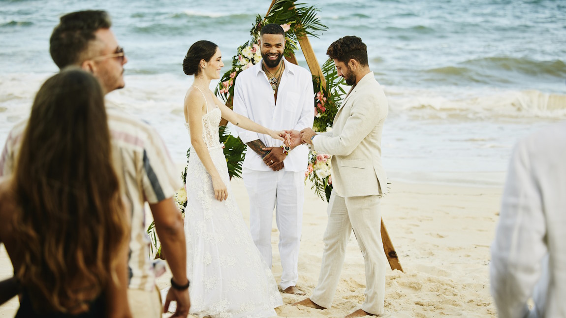 A small wedding party on the roof of a tropical villa..