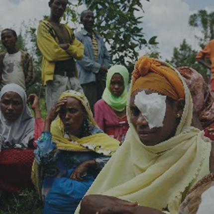 A person with a covering over her eye