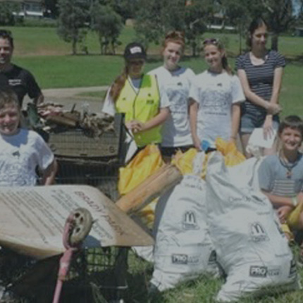 A group of people cleaning up